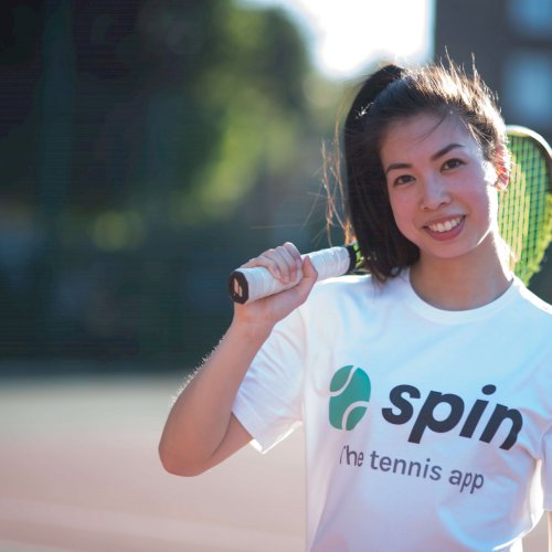 Asian female tennis player smiling